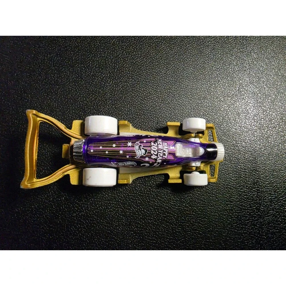 Lot of 4 loose Hot Wheels vehicles in pre-owned condition.